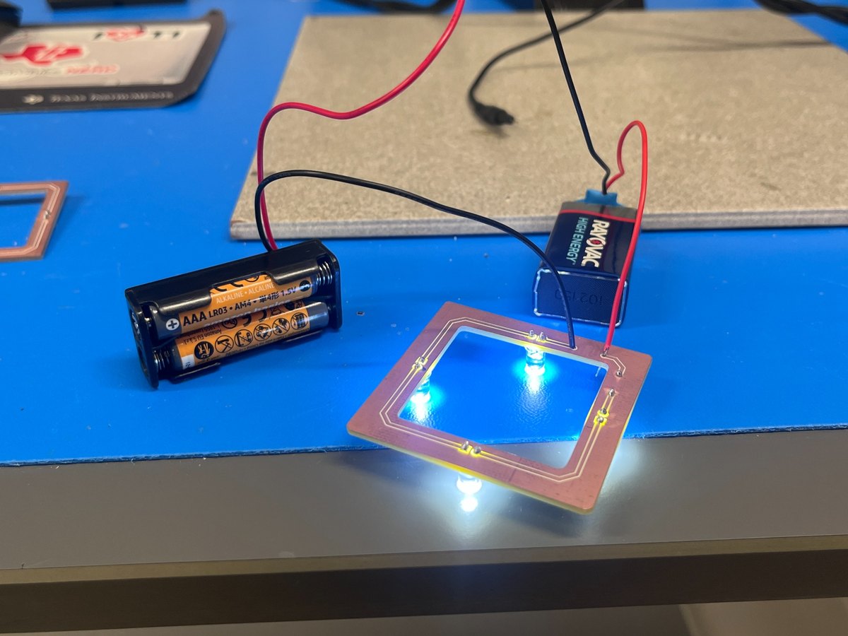 Finished LED ring light PCB powered on at the bench
